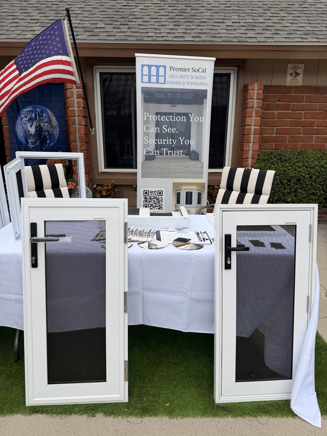 Premier SoCal display table with sample security screen doors and a banner reading Protection You Can See. Security You Can Trust.