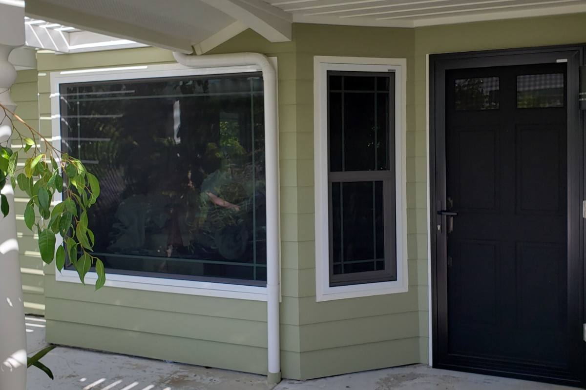 A home with security screens installed on their door and windows, providing protection from bugs and improved home security in Southern California.